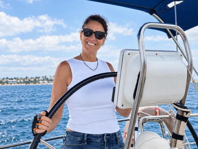Cristina Garcés at the helm of a boat